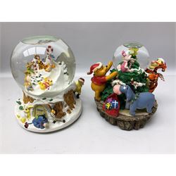Six Disney Winnie the Pooh Christmas snow globes, comprising large Mr Christmas Holiday Snowfall, An Enchanted Christmas, It's A Small World Christmas 1994,  Tree Trimming, 1995 Christmas At Our House and Christmas Band Concert, together with Mr Christmas Holiday Go Round, all with boxes (7)