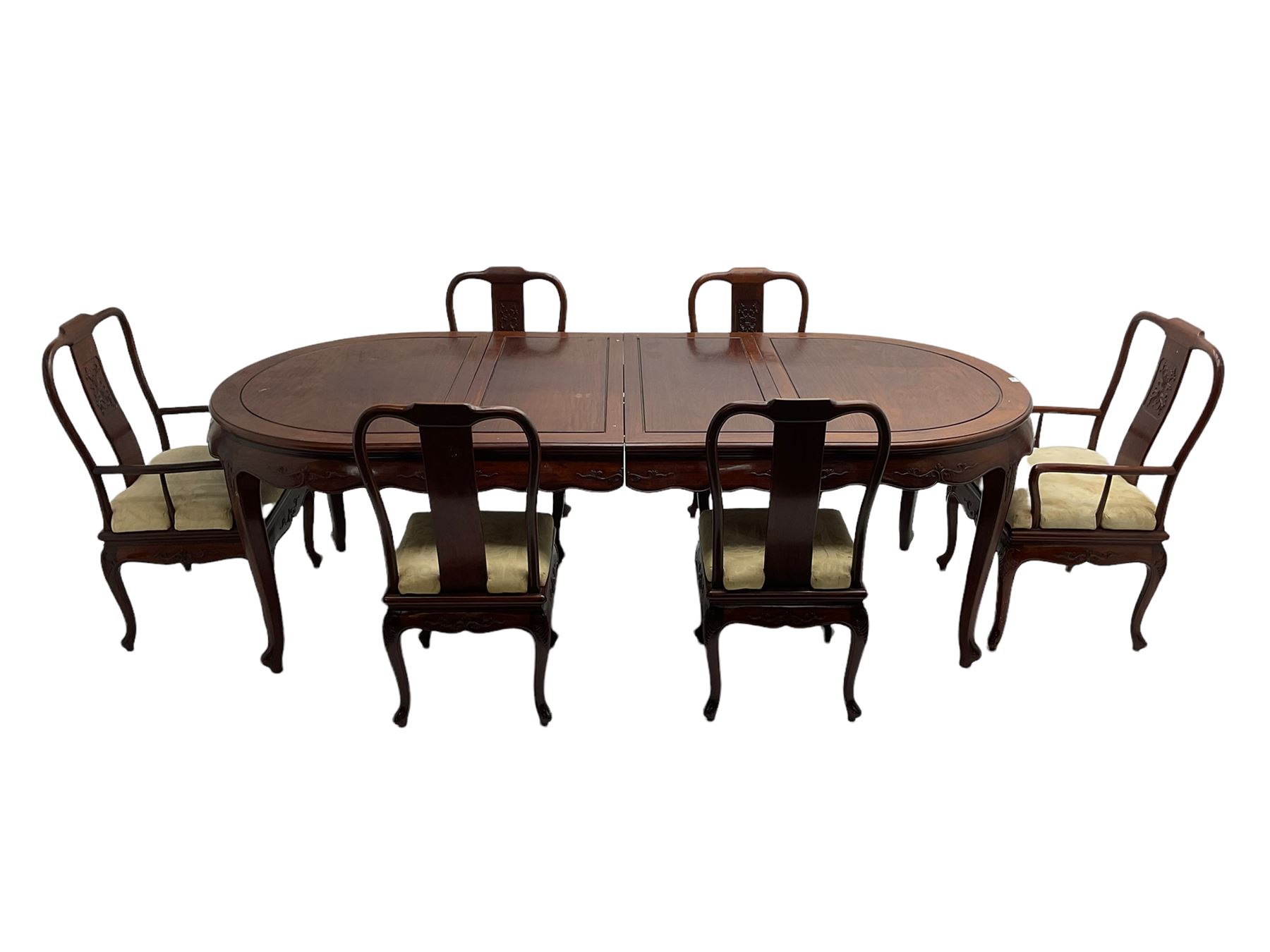 Mid to late 20th century Chinese hardwood extending dining table, two additional leaves, shaped apron carved with foliate scrolls, leaf carved cabriole supports (W246cm, H78cm, D117cm), and set six (4+2) dining chairs with shaped cresting rails over carved splats