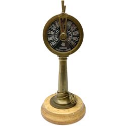 Early 20th century, illuminating brass ship's telegraph by Chadburns of Liverpool and London, on a circular wooden plinth, H55cm