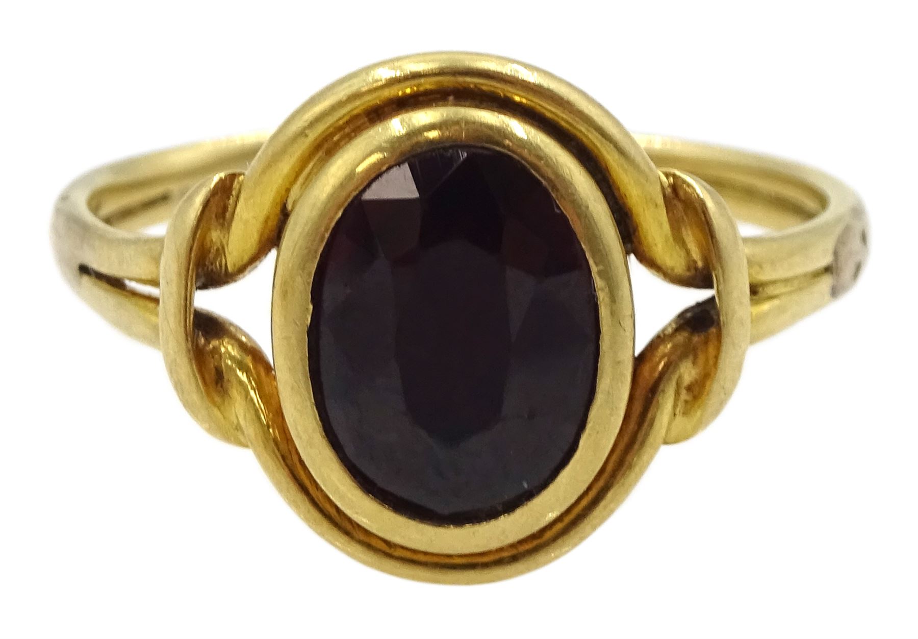 Edwardian 9ct gold shield design locket pendant, with bright cut foliate decoration, Birmingham 1908, gold single stone garnet ring and a 14ct gold knot brooch