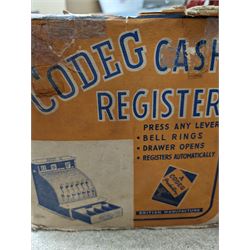 Codeg child's cash register, boxed, a 1930's Societe Nobel Francaise (SNF) doll and another vintage doll