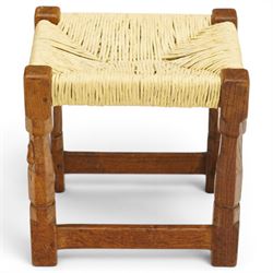 Mouseman - mid-20th century oak stool, the rectangular rush seat raised on turned octagonal supports united by box stretcher, with carved mouse signature, by the workshop of Robert Thompson of Kilburn