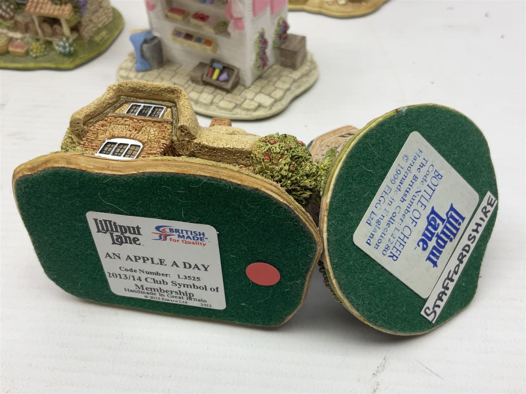 Eighteen Lilliput Lanes, including The Penny Farthing, The Pigsty, Borrowdale School, Fairy Cake Tearoom, An Apple a Day,Ladybird Cottage etc, all with original boxes 