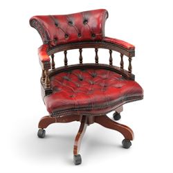 Georgian design captains swivel desk chair, rolled cresting rail over open spindle back on swivel action, upholstered in buttoned oxblood leather
