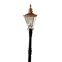 Victorian style cast iron street lamp post, with copper and glass lantern top