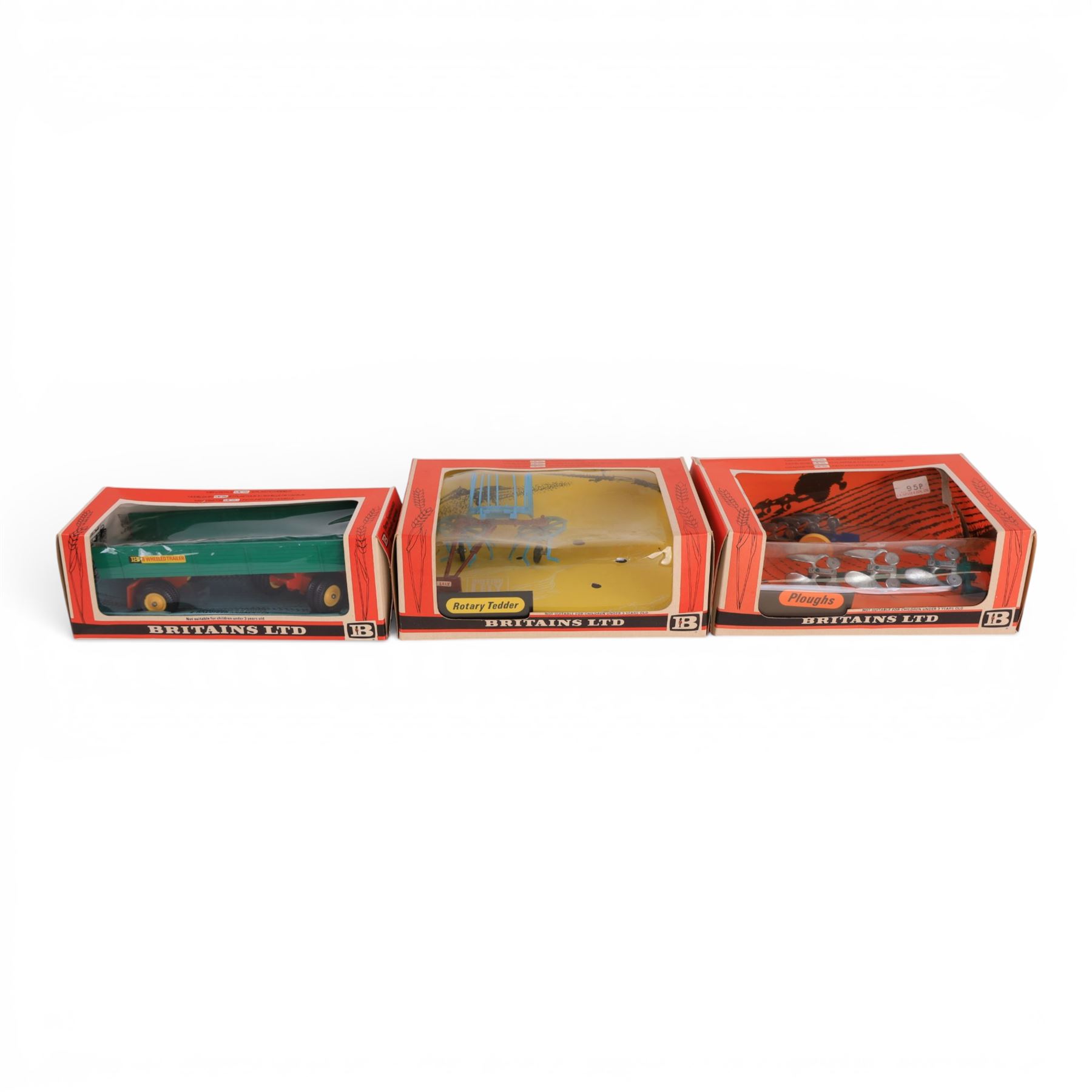 Britains Ltd 1:32 scale farm implements, comprising no. 9556 Hay Baler, no. 9549 Manure Spreader, no. 9553 Disc Harrow, no. 9557 Bale Sledge, no. 9577 Seed Drill, no. 9561 Cultivator Herse, no. 9546 Ploughs and no. 9558 Wheeled Trailer, all boxed