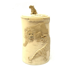Indian ivory tusk box, second quarter of 20th century, of tapering form carved in relief with lions and tiger, the lift-off lid with seated tiger knop H14cm