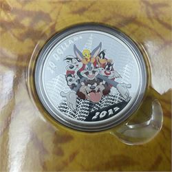 Three Royal Canadian Mint 2015 'Looney Tunes Classic Scenes' fine silver coins, comprising 'Fast and Furry-ous' thirty dollars, 'Birds Anonymous' thirty dollars and 'Merrie Melodies' twenty dollars, all cased with certificates