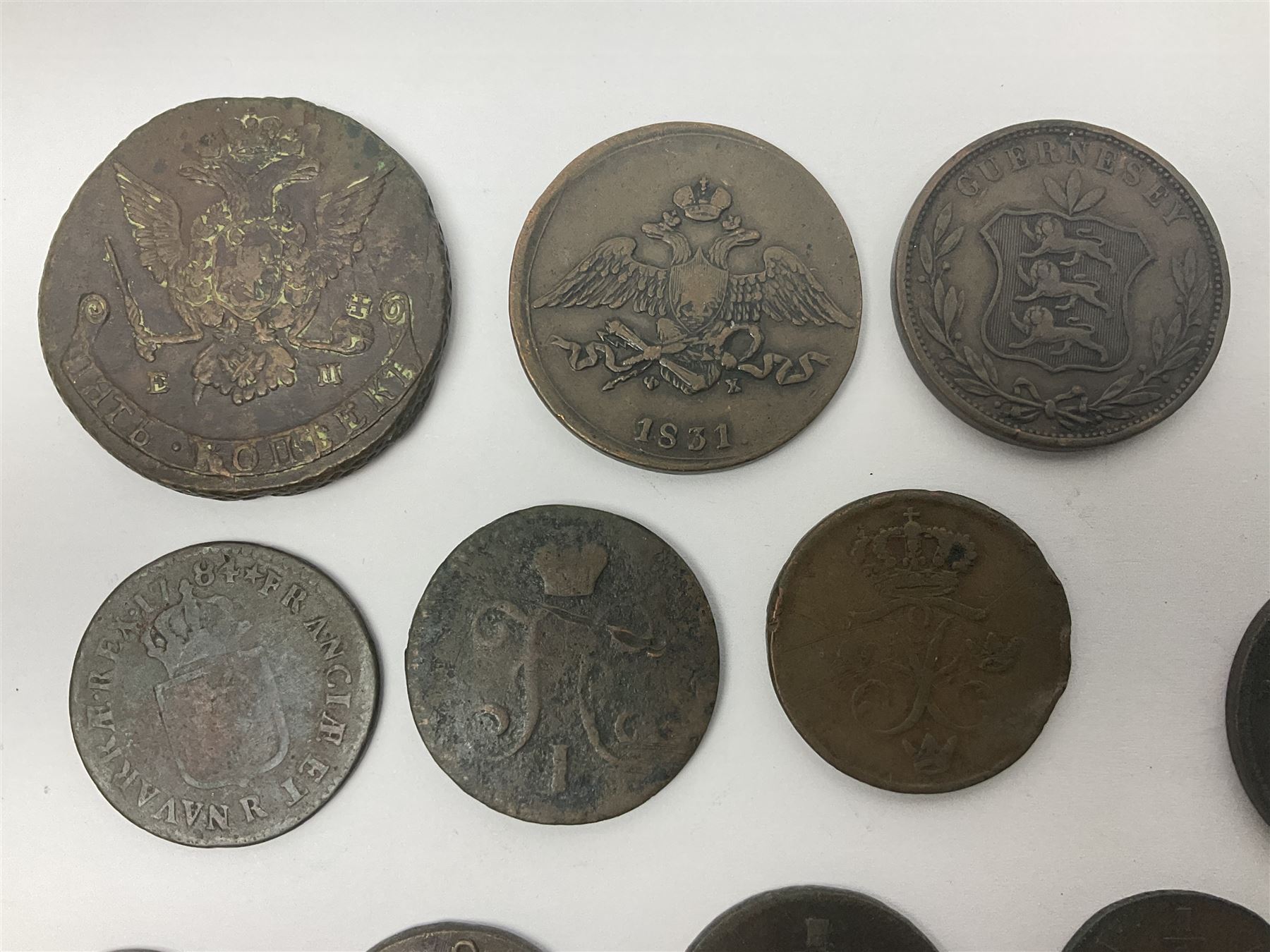 Thirty six late 18th century and onwards United Kingdom and World coins and tokens, to include 1772 Catherine II 5 Kopecks, Swedish quarter and half Skilling pieces dated 1809 and 1806, two Skilling Courant piece dated 1810, 1831 Isle of Man half penny token etc 