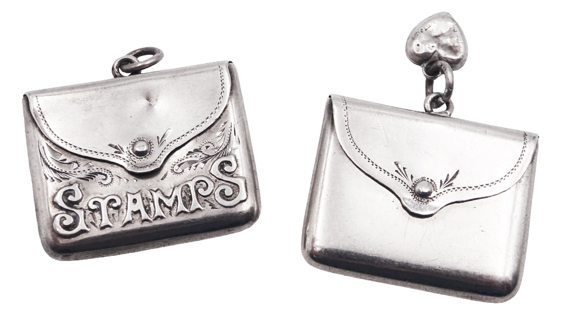 Two Edwardian silver stamp holders modelled in the form of envelopes, the first example detailed 'Stamps', hallmarked Crisford & Norris Ltd, Birmingham 1903, the second of plain form, hallmarked Crisford & Norris Ltd, Birmingham 1902, approximate total weight 0.38 ozt (11.8 grams)