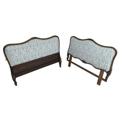 French style shaped head and foot boards, moulded frames carved with foliage, upholstered in blue and white patterned fabric 