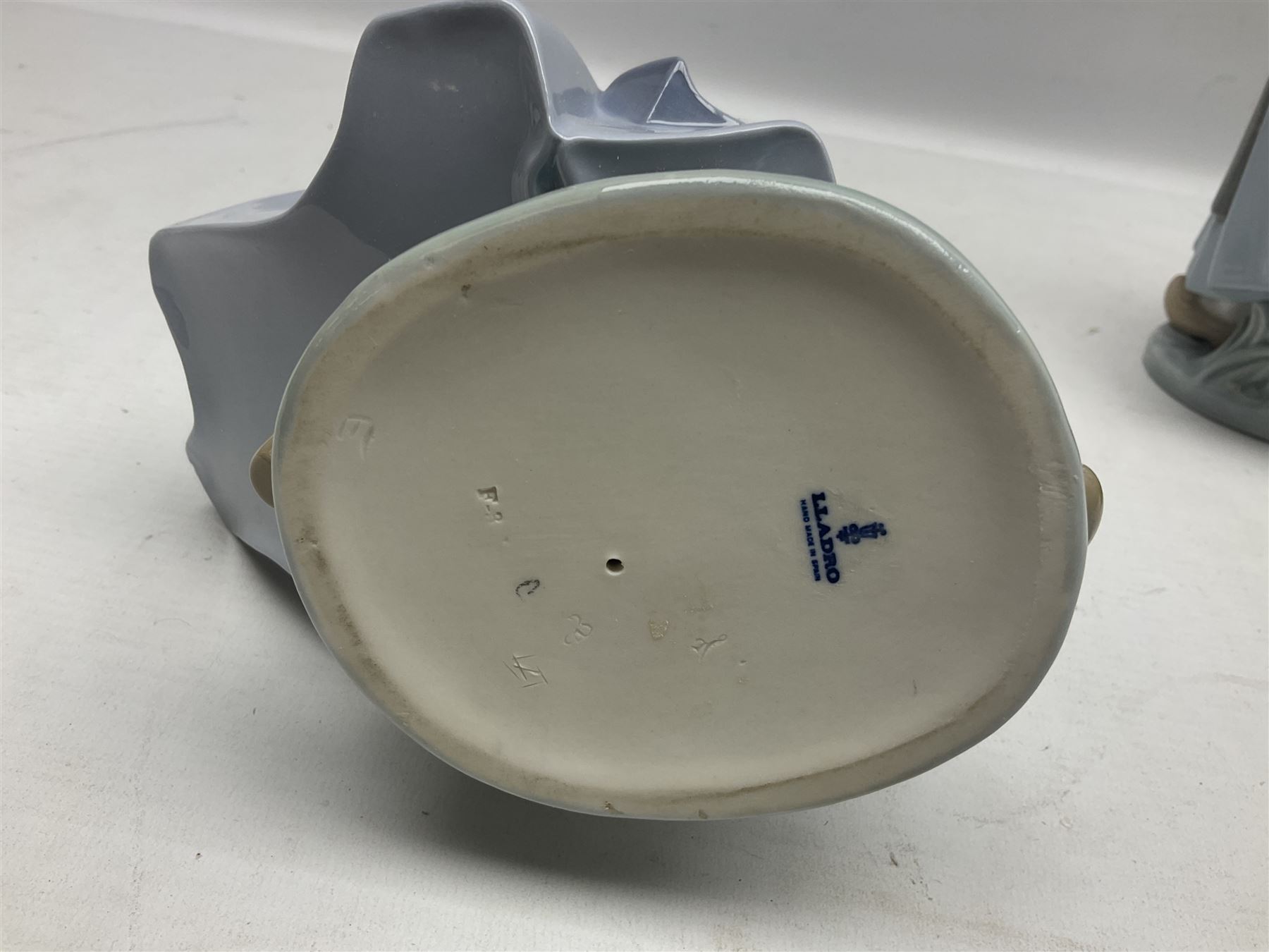 Three Lladro figures, comprising Dutch Girl with Braids no 5063, Dutch Girl with Duck no 5066 and Aracely with Ducks, all with original boxes, largest example H25cm