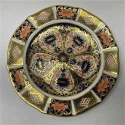 20th century Royal Crown Derby Imari 1128 pattern plates, comprising four side plates and three smaller examples, with printed and painted marks beneath, including illustration date codes for 1918 and 1920, and Roman numeral date code for 1979, larger examples D18cm, smaller D15cm, (7)

