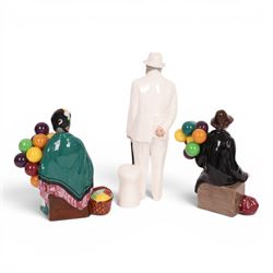 Three Royal Doulton figures, comprising  Churchill HN3057, The Old Balloon Seller HN1315 and The Balloon Man HN 1954