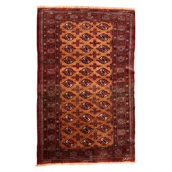 Afghan Bokhara dark amber and terracotta ground rug, decorated with Hac and Gul motifs  wi...