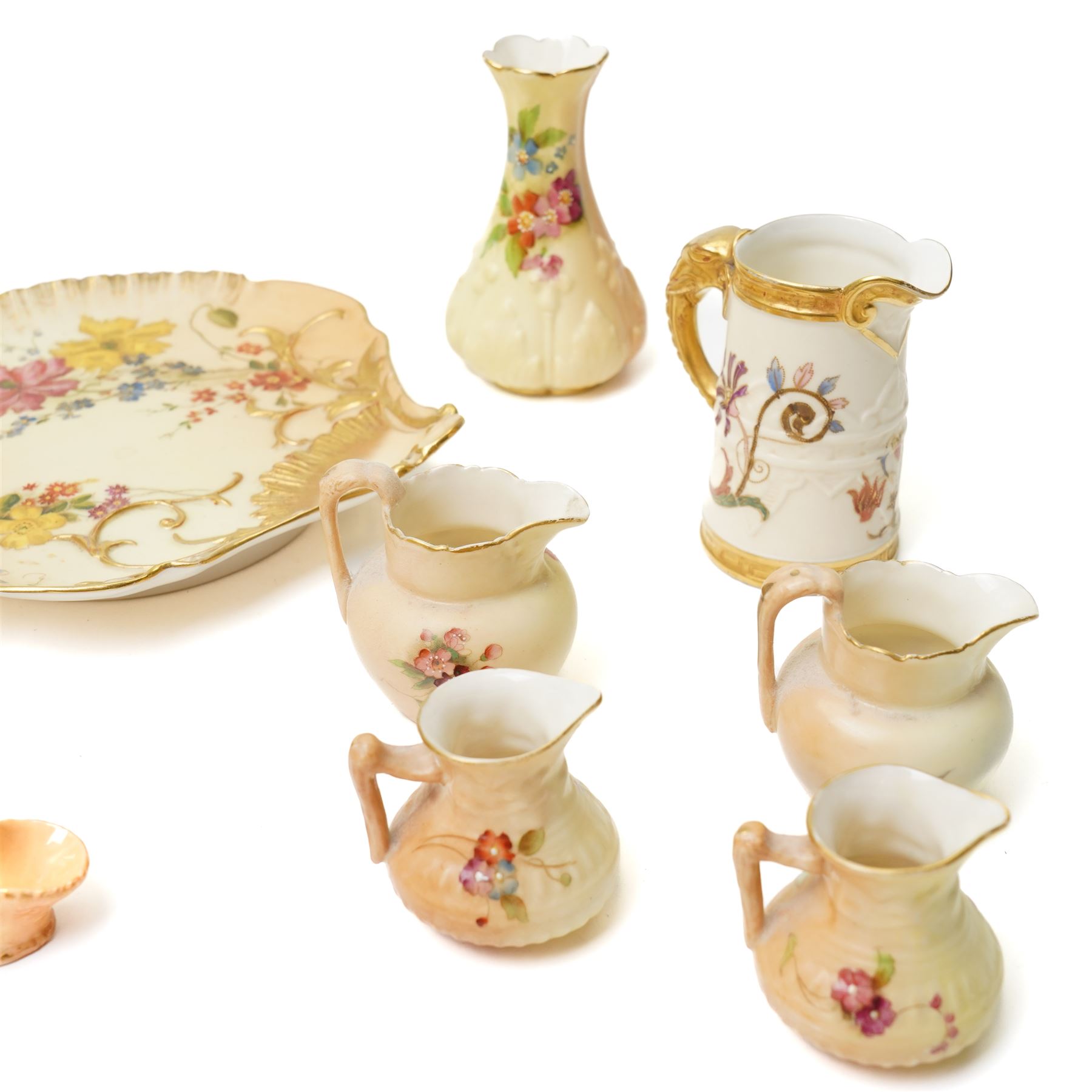 Large collection of miniature Royal Worcester hand-painted blush ivory wares, including various miniature baskets, large dish, miniature jug and others, with printed mark to bases