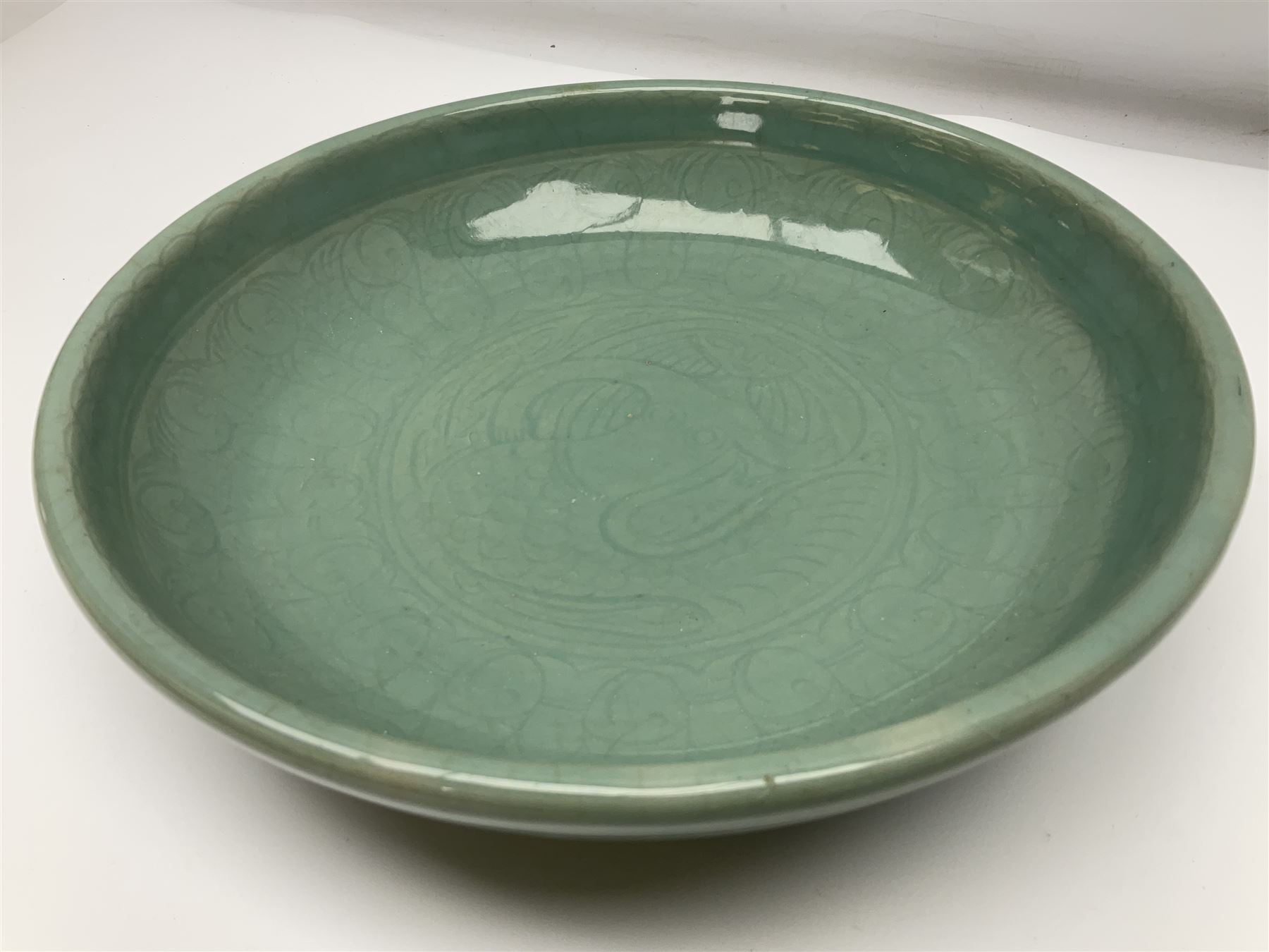 Agnete Hoy (1914-2000): Bullers studio pottery celadon glazed bowl, the interior with incised decoration depicting a Mermaid, D28.5cm