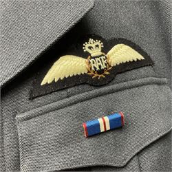 Two post-WWII British Army No.2 Dress tunics, one with Green Howards buttons; army shirt dated 1951; Royal Fleet Auxilliary jacket with trousers; three RAF/WAAF uniforms and RAF Greatcoat; and three canvas/webbing bags, two dated 1943 & 1945