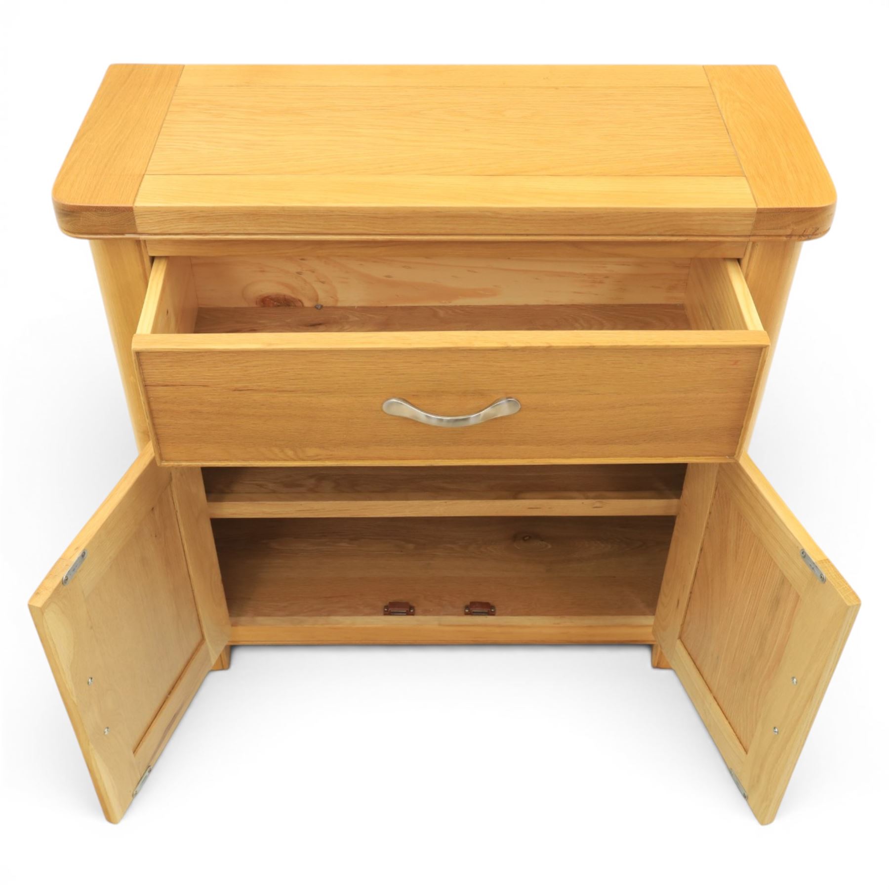Modern oak living room set comprising; a small side cabinet, corner TV stand and coffee table, cabinet with single drawer and cabinet, finished with metal handles (H 80cm, D 32cm, W 80cm), TV stand with open recess and rear aperture for wires, above nine drawers with chrome pulls (H 62cm, D 50cm, W 84cm)  coffee table with curved edges and full length undertier (H 50cm, D 60cm, W 90cm)  
