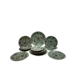 Thirteen 19th/ early 20th century Chinese famille rose celadon plates, each painted with insects, birds and foliage, various sizes, largest D25cm, smallest D15cm (13)