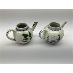 Two 18th century miniature or toy pearlware teapots, the first example lacking cover decorated with an exotic bird, the second with cover painted in underglaze blue with hut and fence, second example approximately H8cm