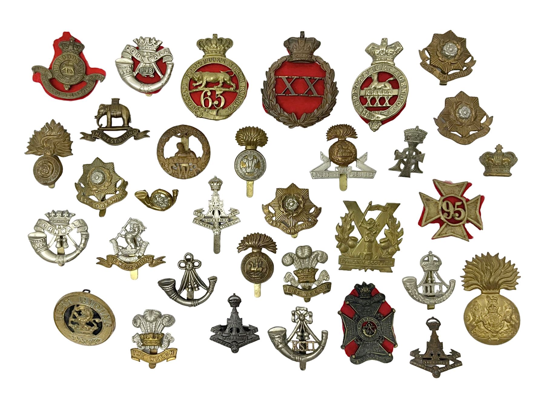 Over thirty regimental cap badges for fusiliers, Yorkshire interest, Light Infantry etc including Royal Scots and Welsh fusiliers, Durham L.I., KO Yorkshire L.I., Oxford & Bucks L.I., Green Howards, East Yorkshire, West Riding, York North Riding etc 