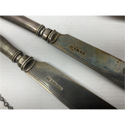 Silver plated tray, with shaped rim and embossed with a dog and crown to centre, stamped Valenti, together with three silver plated decanter labels, two port and one Bucellas, a plated cream jug with embossed floral decoration and a pair of plated fish knives engraved with double headed eagle to handle, tray W25.5