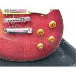 1980s Les Paul Epiphone limited edition cut-away electric guitar by Gibson, the burgundy coloured body with two pick-ups, volume and tone knobs and scratch plate, original tuning pegs, serial no.U6030215, 101cm overall; in modern Kinsman fitted carrying case
