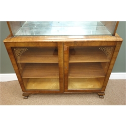  Early 20th century walnut display cabinet, two glass sliding doors enclosing mirrored interior, two glazed doors, ball and claw feet, W98cm, H121cm, D31cm  