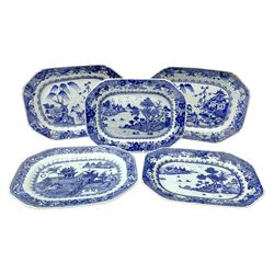 Five late 18th/early 19th century Chinese export blue and white platters, of canted form, comprising two pairs and a further single example, decorated with landscapes set with typical motifs including pagodas, fence, and willow and pine trees, within spearhead and moth and diaper cell borders, first pair W31.5cm, second pair W28.5cm, single example W30cm