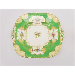 19th century Minton tea set, comprising twelve teacups, eleven saucers, fifteen side plates, cream jug, slop bowl, and two cake plates, decorated with panels of floral sprays, upon a green ground, heightened with gilt throughout, with printed puce mark beneath, and pattern number 5329
