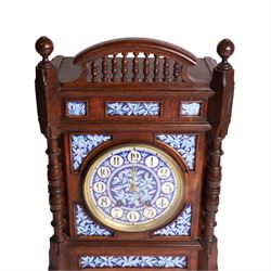 Aesthetic Movement mantel clock, in an oak case with turned detail and ceramic panels decorated with blue and white holly with berries, H48cm