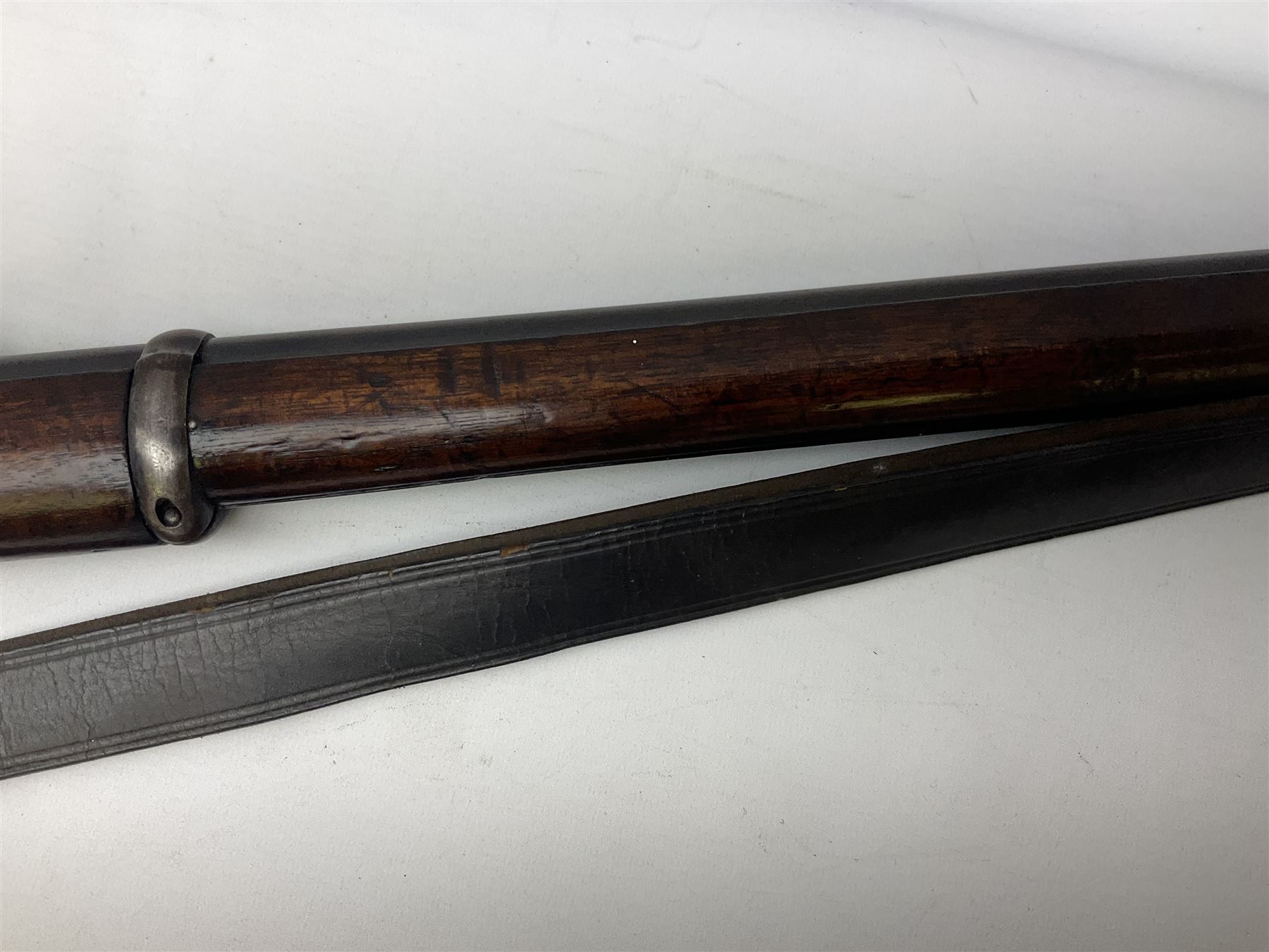 Braendlin Armoury Martini action .577/450 falling back rifle, the 85cm rifled barrel stamped Alex. Henry Edinburgh & London with two barrel bands including Yatagan bayonet side fitting and clearing rod under, with leather sling, serial no.13332, L126cm (NB. Firing pin broken). 