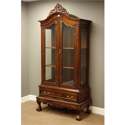  French style mahogany display cabinet, carved shell and scrolled pediment above glazed arched doors, single drawer, on ball and claw feet, W90cm, H206cm, D49cm  