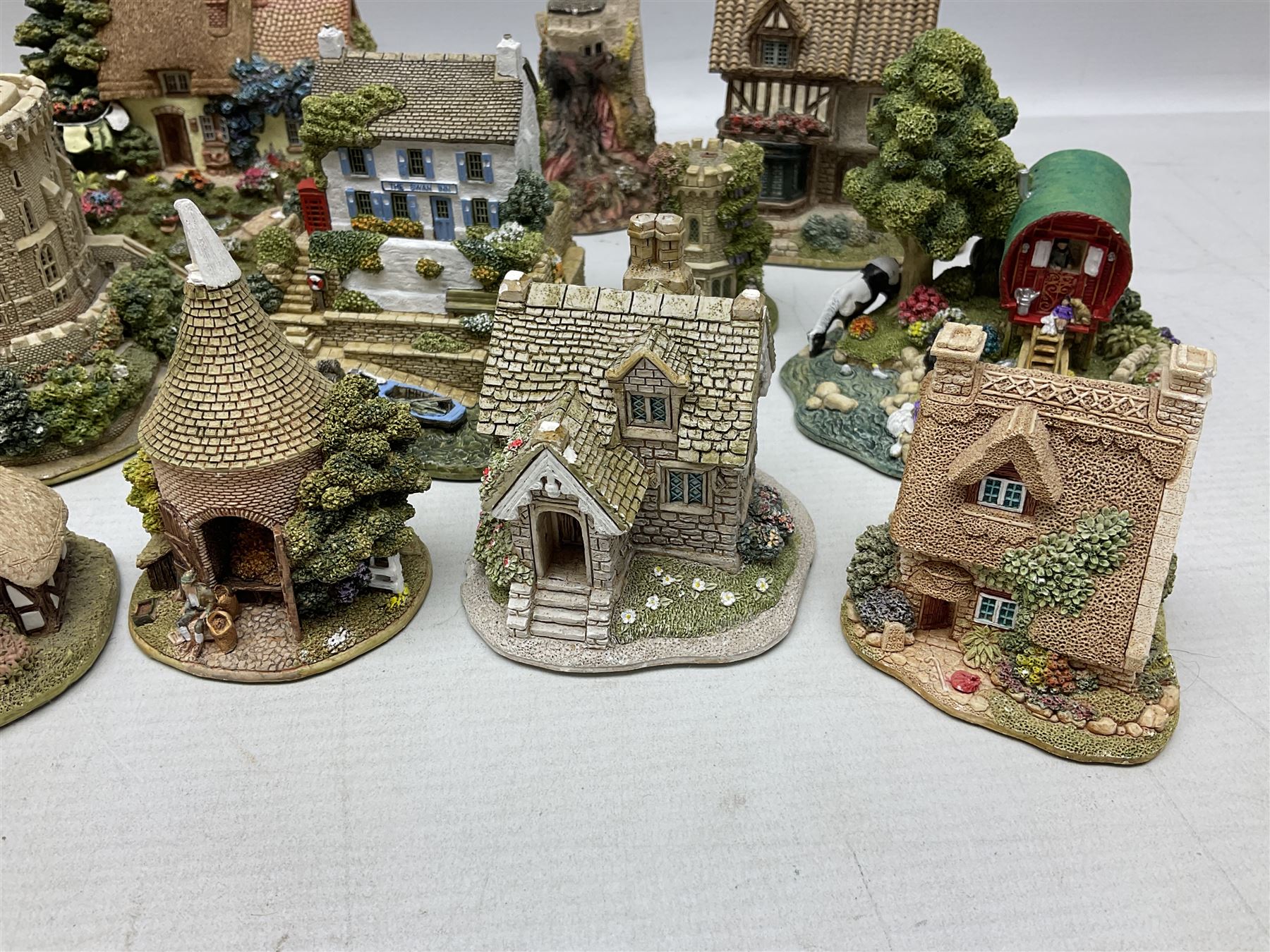 Sixteen Lilliput Lanes, to include The Golden Jubilee, Round Tower - Windsor Castle, Castle of the Golden Chalice, Travellers Rest, with box and deed,  Summer Days, Sunshine Creek, Writing with Lewis Carol, with box and deed,  etc 