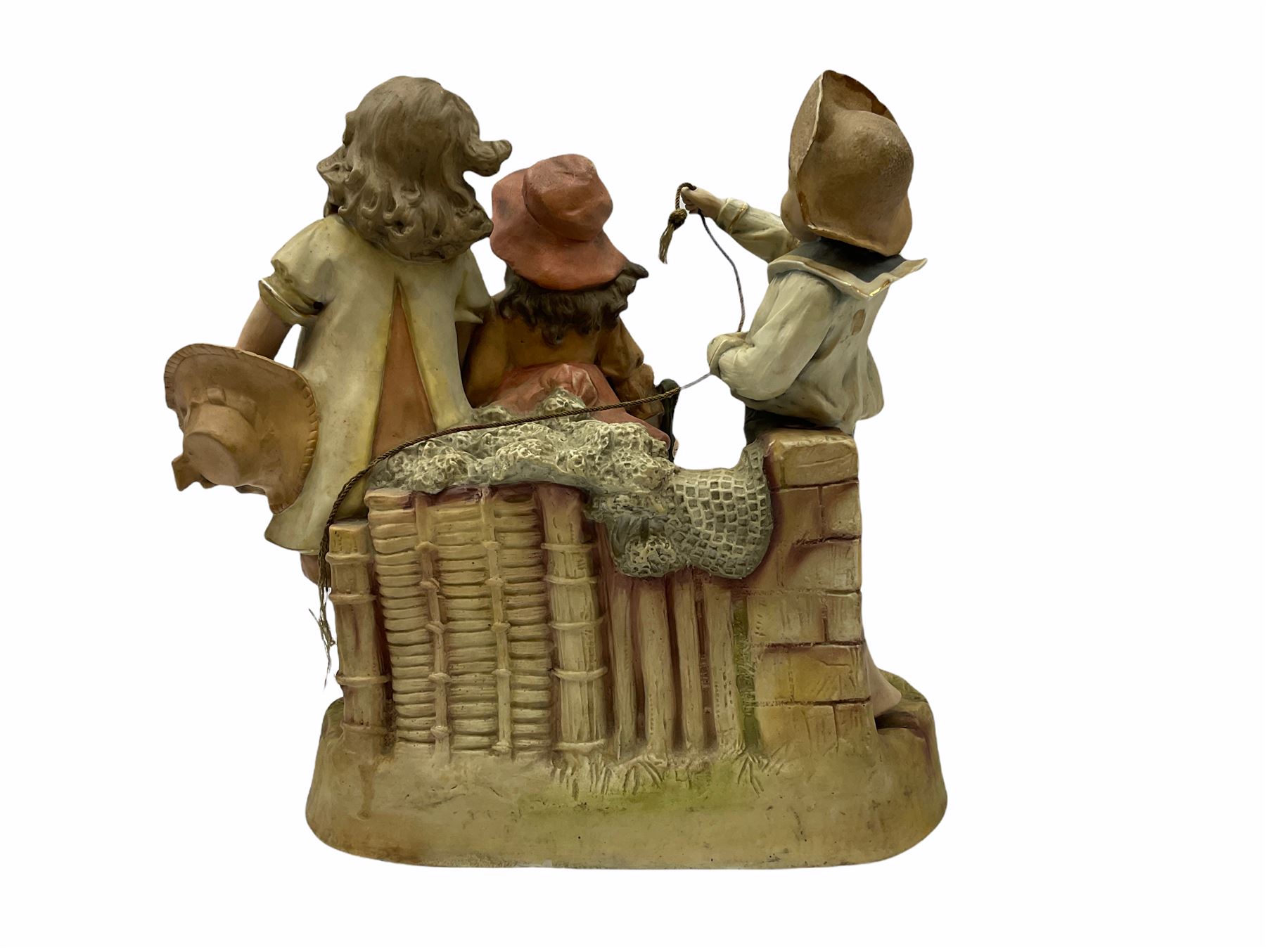 Large Victorian bisque figure group, modelled as three children at a beach with fishing net and seaweed, inspired by the Victorian painting 'The Sea Horses', H33cm L36cm 