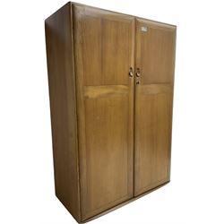 Ercol - light elm double wardrobe, enclosed by two panelled doors, fitted with hanging rail