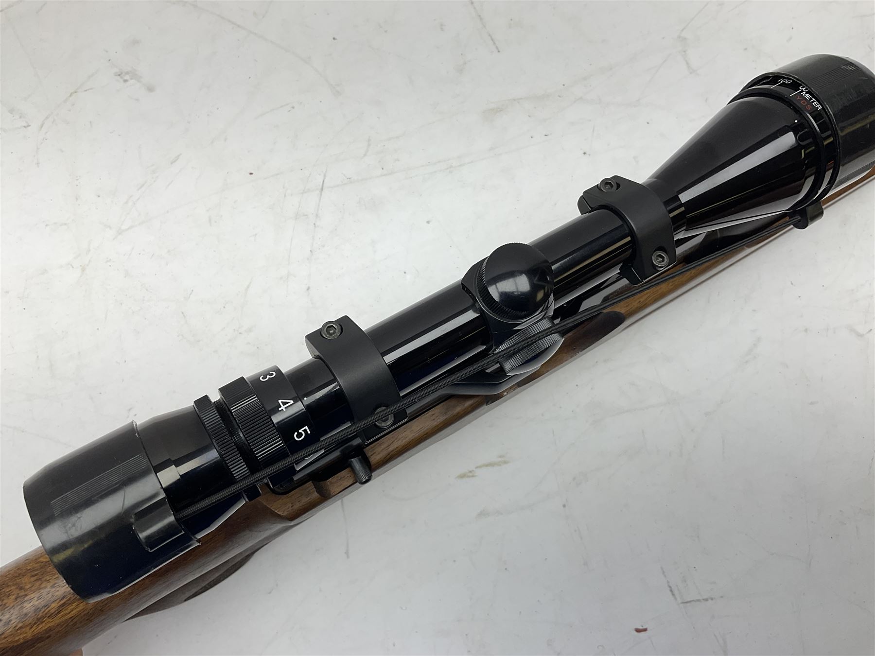 Weihrauch HW100 .22 calibre PCP repeating air rifle; walnut thumbhole stock with textured pistol-grip; Nikko Stirling Silver Crown 3-9x40 telescopic sight; integral sound moderator; No.1901181 L99cm overall; in gun sling; with Logun Combi-Pump and quantity of pellets