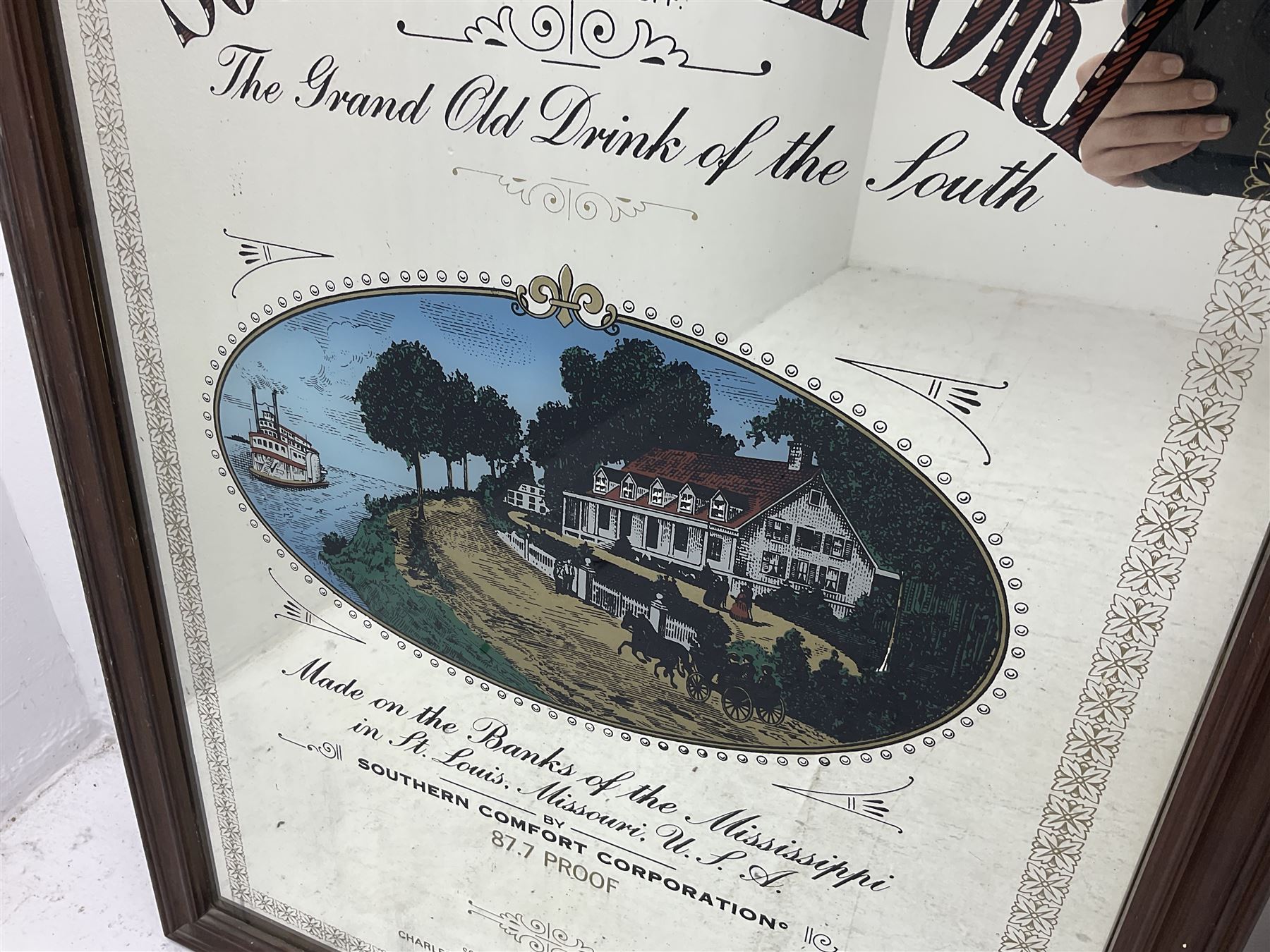 Southern Comfort advertising mirror, together with a framed star sign print, mirror H90cm