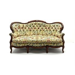 Victorian mahogany framed two seat, shaped back, scrolling arms, cabriole feet, upholstered in a deep buttoned ivory fabric with floral pattern