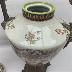 Wong Lee, twin handled ceramic urn with enamelled floral decoration and bronzed metal mounts, upon a square base, marked to base, together with similar twin handled urn with enamelled Cherub decoration, largest H44cm