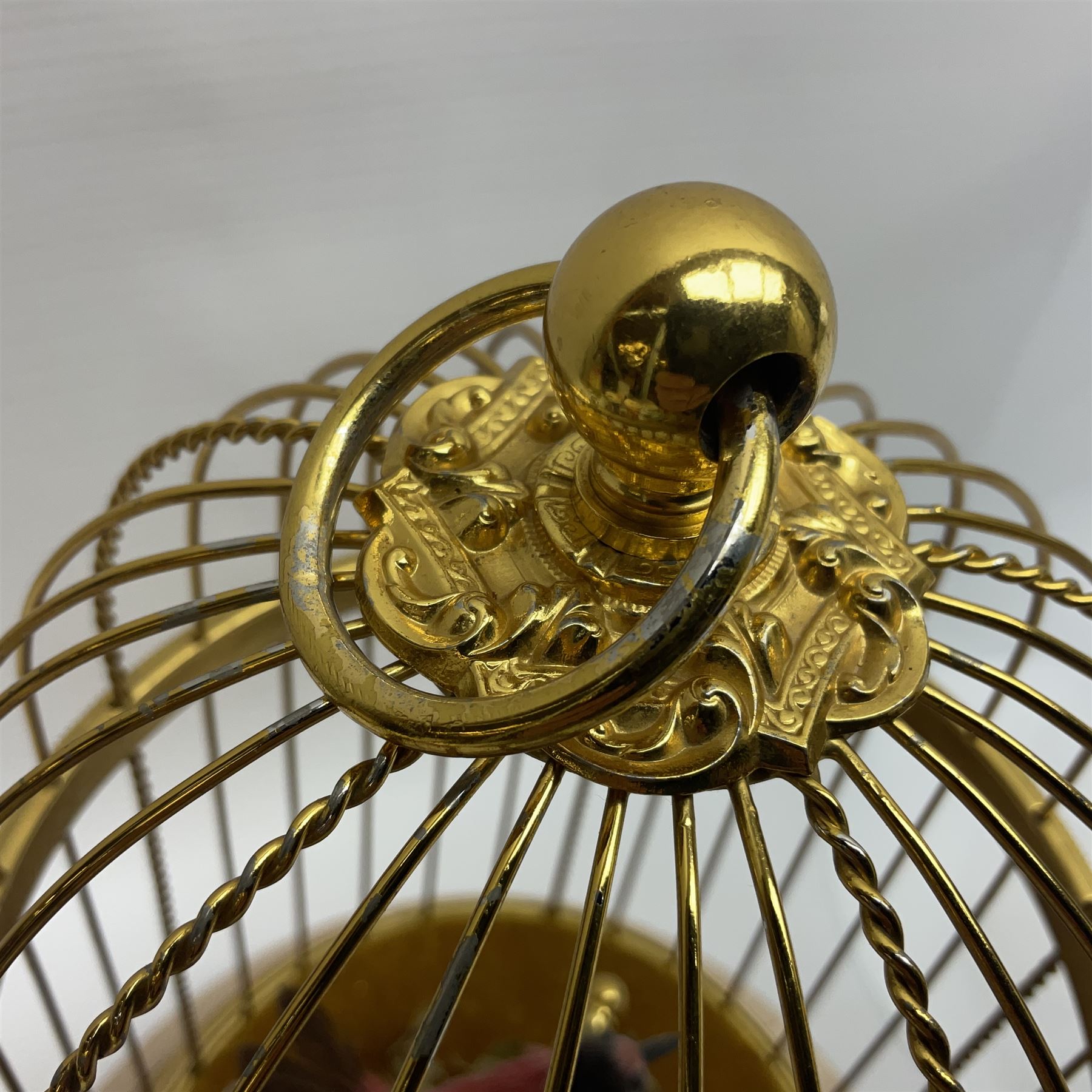 Swiss Reuge Music bird cage automaton music box, the bird with articulated head and beak, in a gilt brass cage, with a glass dome and stand, H30cm
