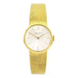 International Watch Company ladies 18ct gold manual wind wristwatch, silvered dial with baton hour markers, on integral 18ct gold bracelet, stamped 750, with guarantee dated 1968