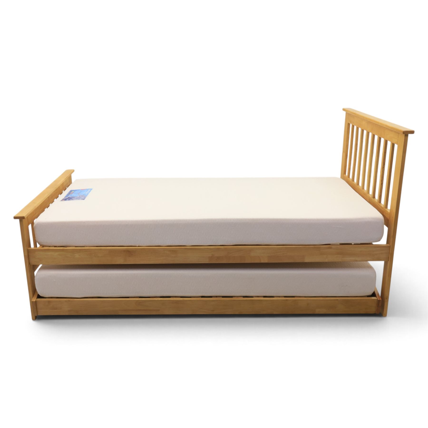 Contemporary light oak trundle bed, slatted headboard and footboard,  incorporating pull-out trundle bed on castors, complete with two memory foam mattresses