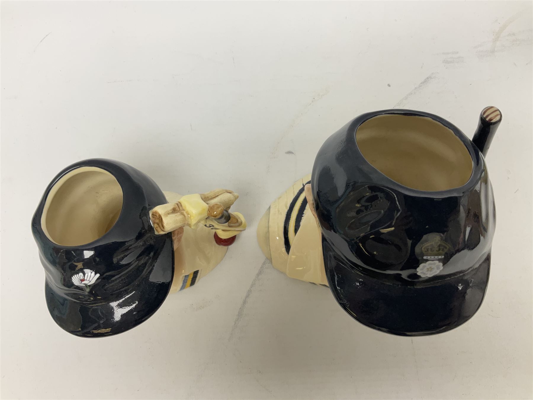 Royal Doulton limited edition figure of Geoffrey Boycott O.B.E, HN3890, no 253/8114, together with four Royal Doulton limited edition character jugs of cricket interest, comprising The Hampshire Cricketer D 6739, no 3903/5000, Freddie Trueman O.B.E, D 7090, no 502/9500, Brian Johnners Johnston, D 7018, no 1281/9500 and Len Hutton D 6945 no 263/9500, four with certificates, one with box