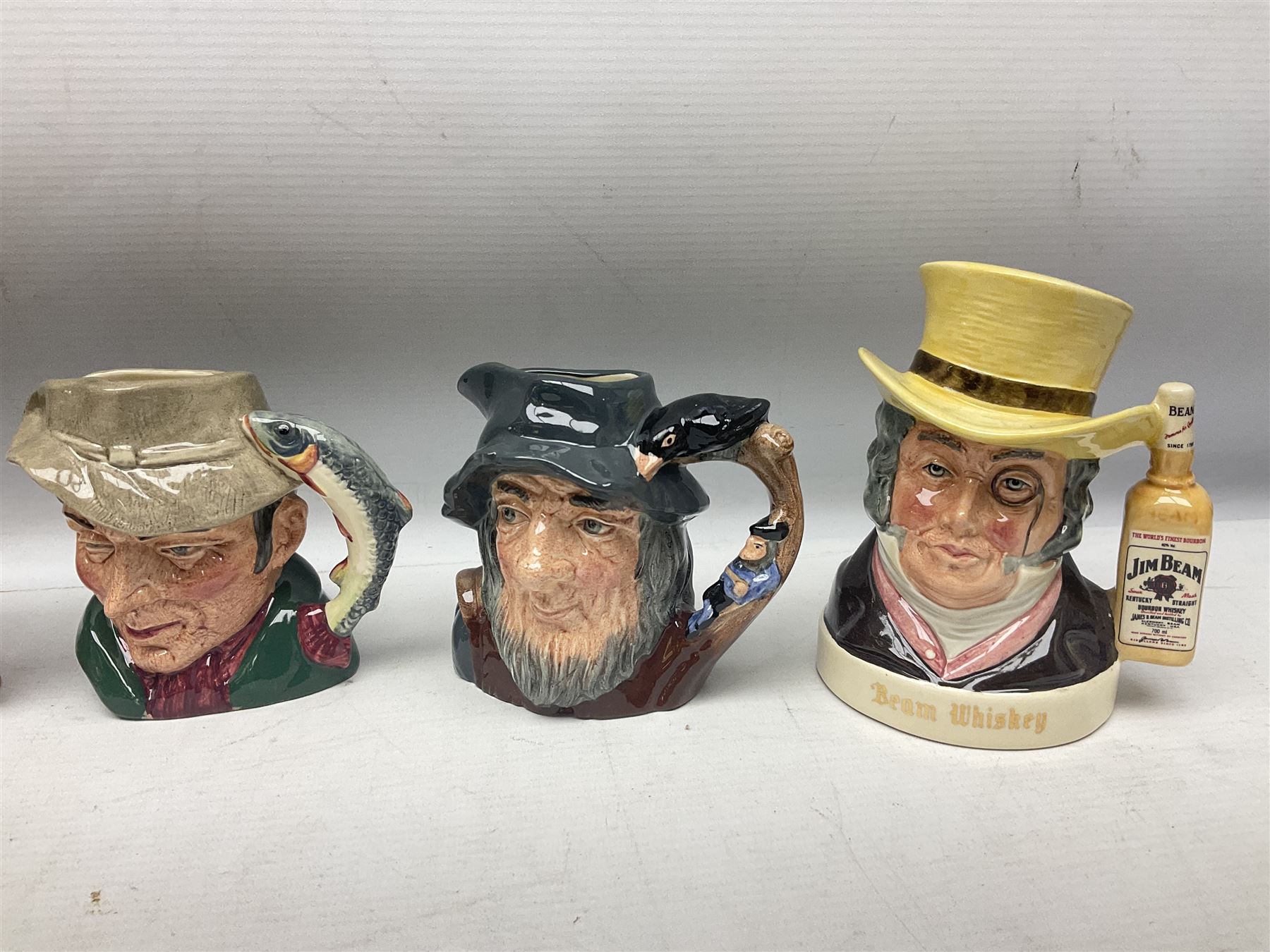 Large collection of Royal Doulton miniature character jugs, to include The Postman D6801, The London 'Bobby' D6762, Old Salt, D6554, Sir Henry Doulton D6703 etc  