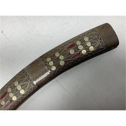 Late 19th/early 20th century Moroccan nimcha dagger-sword, the 40cm curving steel blade with engraved decoration on both sides; shaped hardwood hilt inlaid with brass, white metal wires and red coloured panels; in similarly inlaid scabbard L61cm overall