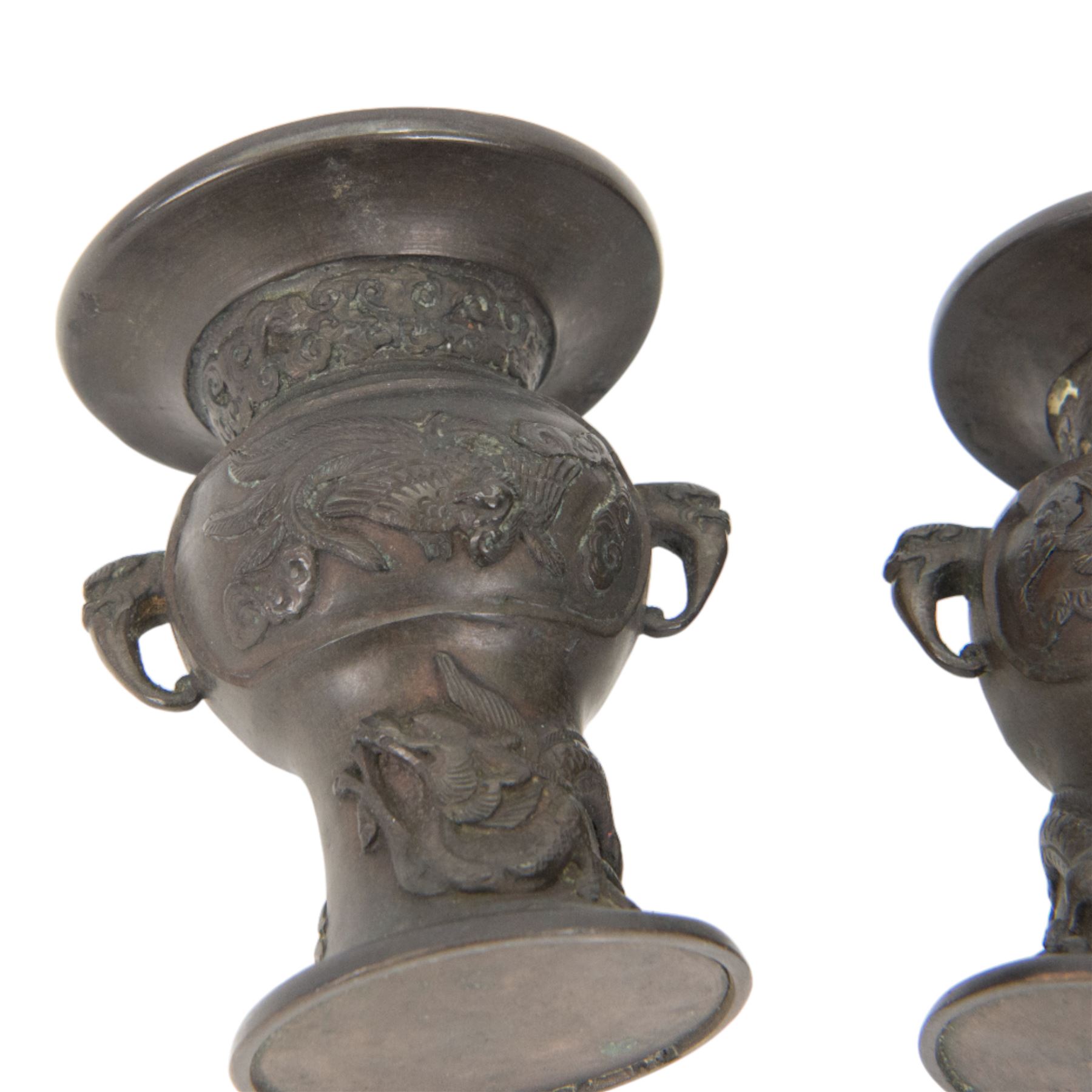 Pair of Japanese bronzed vases, decorated in relief with with birds and dragons, with dragon head handles, H13cm
