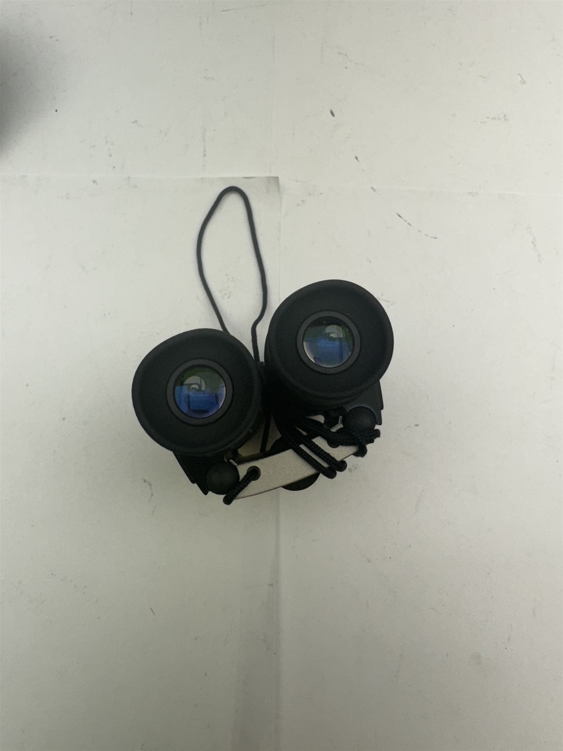 Four pairs of binoculars, to include Carl Zeiss Jena Jenoptem 8x30W serial no. 3750814, Nikon Sporting II 8x40 serial no. 604672, Minolta Pocket II 8x22 Field 7 and Jessops 12x25 Field 4.8 84m/1000m, all in carrying cases 