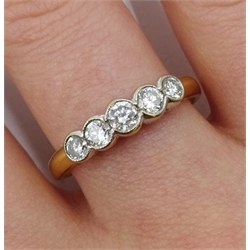 18ct gold five stone diamond ring, bezel set, London 1995